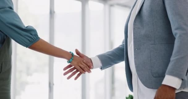 Handshake, office and business people in partnership, agreement or onboarding b2b contract. Meeting, company deal and professional colleagues shaking hands for welcome or greeting in the workplace - Materiał filmowy, wideo