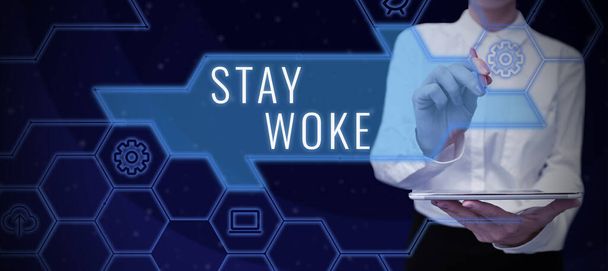 Tekst pokazujący inspirację Stay Woke, Business concept being aware of your surroundings and things going on Keep informed - Zdjęcie, obraz