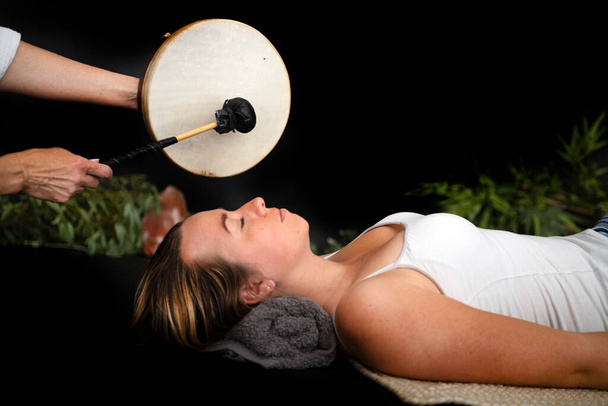 woman and energy healing  in front of black background - Photo, Image