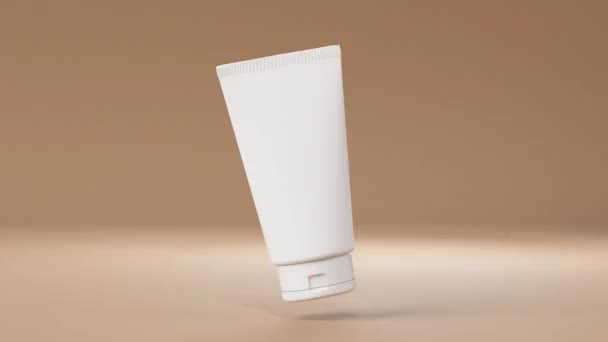 Plastic cosmetische crème buis mockup drijvende roterende op bruine achtergrond beweging 3D render, huidverzorgingsproduct container template, schoonheid merk verpakking - Video