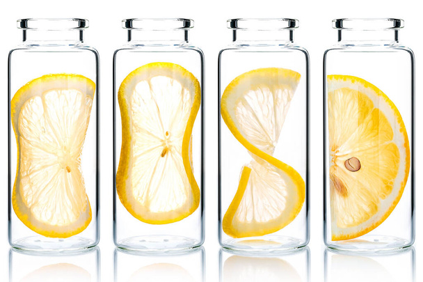Homemade skin care lemon slice and lemon twist in glass bottles isolated on white background. - Foto, imagen