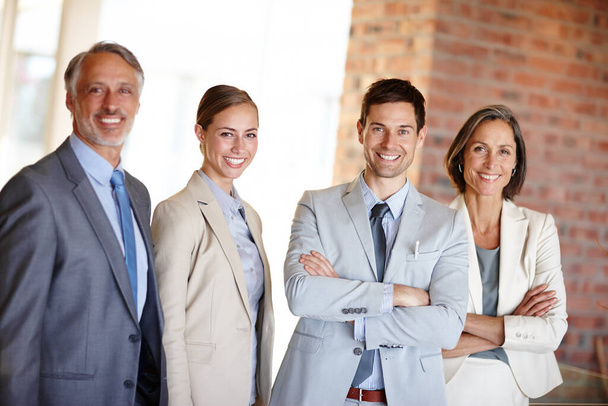 Success begins with a great team. A cropped portrait of a confident team of businesspeople standing at together at work - Foto, imagen