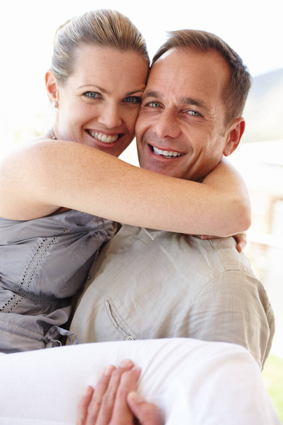 Love has everything to do with it. A close up of a happy couple holding each other affectionately - Foto, immagini