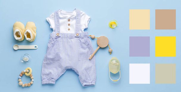Baby clothes with accessories on blue background. Different color patterns - Photo, Image