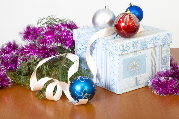 Tinsel, spheres for an ornament of a fur-tree and a gift in beau - Photo, Image