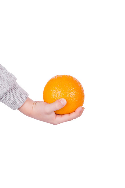 Orange and hand - Φωτογραφία, εικόνα