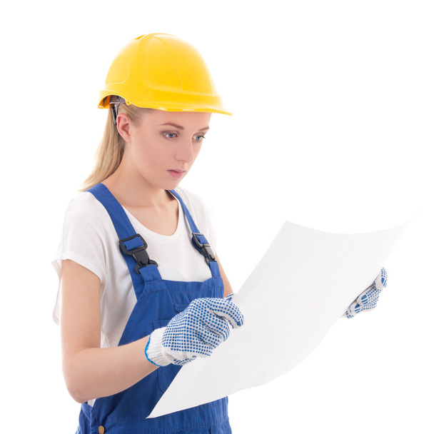 mladá žena v modrých tvůrce uniformu s stavební plán, samostatný  - Fotografie, Obrázek