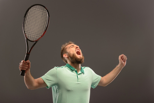 Young man playing tennis - Фото, зображення