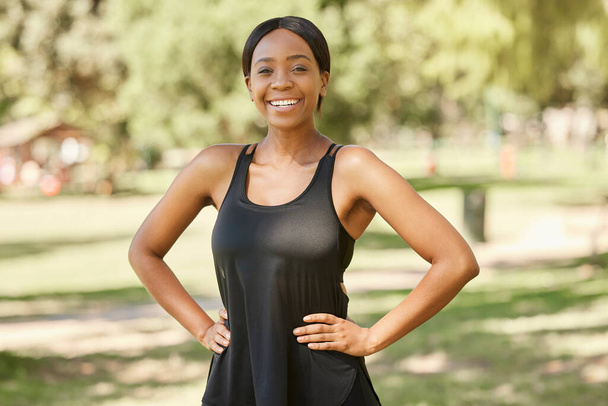 Portrait, fitness or black woman in nature ready for training, exercise or park workout in summer. Wellness, face or healthy African girl with a calm, peaceful or happy smile in Nigeria with freedom. - Zdjęcie, obraz