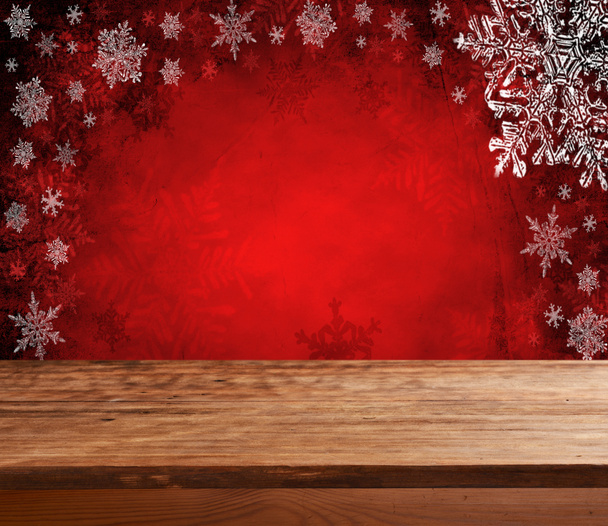Порожній стіл з червоним різдвяним фоном
 - Фото, зображення