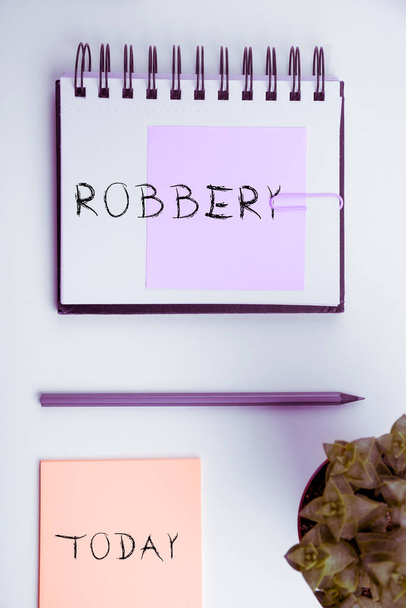 Handwriting text Robbery, Business showcase the action of taking property unlawfully from a person or place by force or threat of force - Foto, imagen