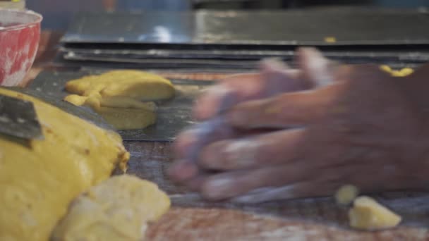 Making dough by hands on wooden table background - Felvétel, videó
