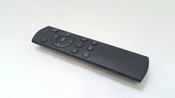 Setup box remote or multimedia remote on white background. Simple tv remote. - Foto, Imagen