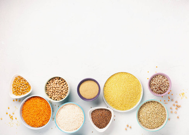 Gluten free, Healthy eating, dieting, balanced food concept. Cereals gluten-free, millet, quinoa, polenta, buckwheat, rice, chickpea on white background. Top view, copy space.  - Fotografie, Obrázek