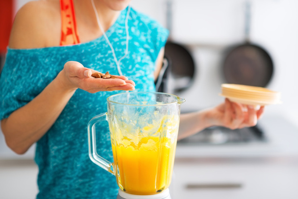 Close-up on fitness young woman making pumpkin smoothie in kitch - Foto, Imagem