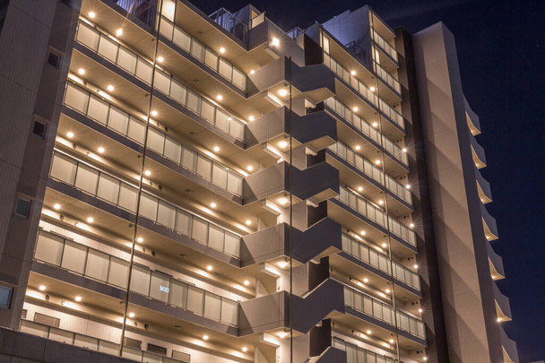 Apartment block at night, Tokyo, Japan. - Zdjęcie, obraz