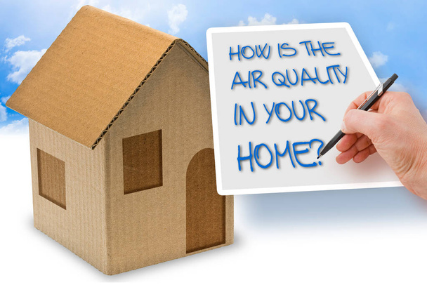 HOW IS THE AIR QUALITY IN YOUR HOME? - concept with a cardboard house - Zdjęcie, obraz