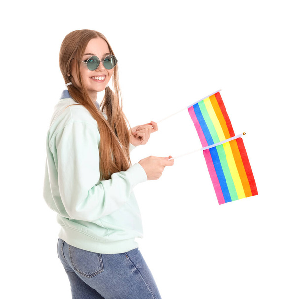 Beautiful young woman in sunglasses with LGBT flags on white background - Foto, afbeelding