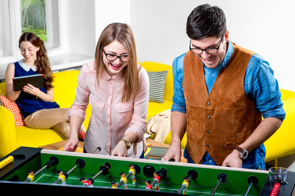 Friends playing table football - Photo, image