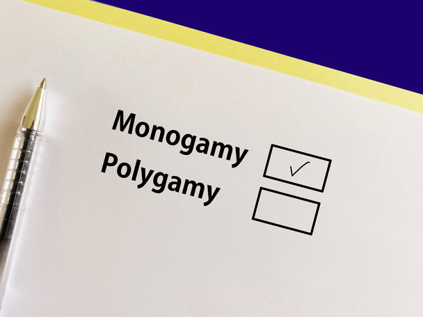 A person is answering question about social issues. He chooses monogamy over polygamy. - Foto, imagen
