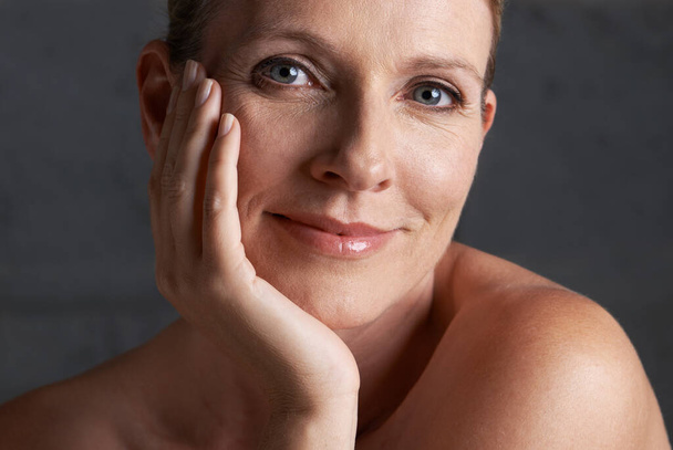 Beauty with some life experience. Studio shot of a mature woman with beautiful skin - Fotografie, Obrázek