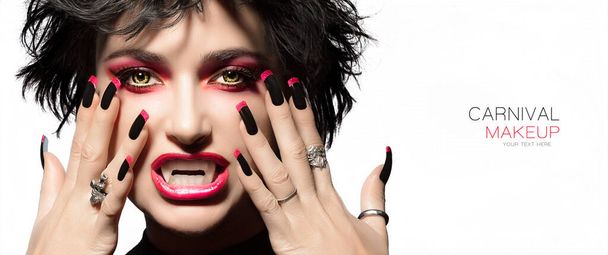 Carnival Beauty and Makeup Concept. High fashion portrait. Sexy vampire woman with gothic make up, georgeous smoky eyes in red to match lipstick and manicured nails with black and red nail art design. - Fotoğraf, Görsel