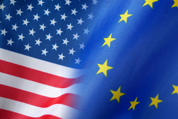 European Union and United States flags, blue european union EU flag and half usa united states of america flag, concept, closeup - Fotografie, Obrázek