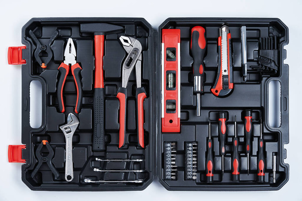 Toolbox with hand instruments for repair, close up. Set of hand tools for maintenance on white background - Foto, afbeelding