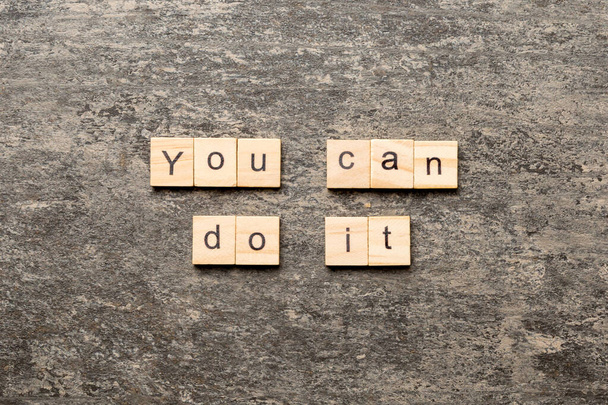 you can do it word written on wood block. you can do it text on table, concept. - Foto, Imagem