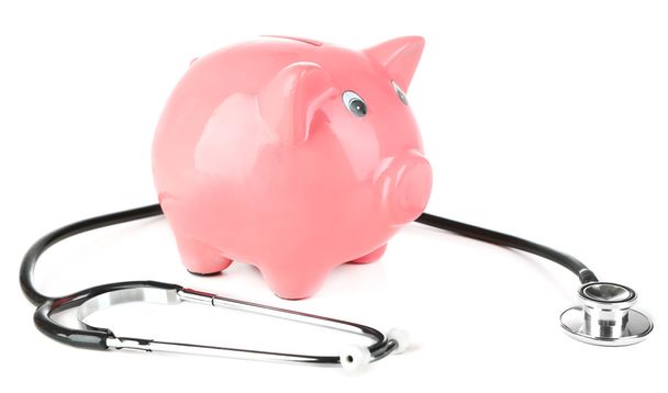 Pink piggy bank with stethoscope isolated on white - Фото, зображення