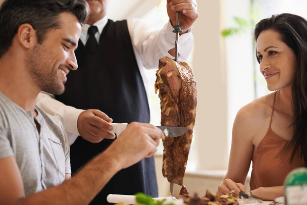 Definitely a dish for meat-lovers. A happy couple having a meat dish at a fine dining restaurant - Photo, Image