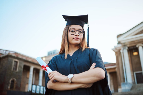 Graduation, education and portrait of woman at university, college and academic campus with diploma certificate. Celebration, graduate ceremony and girl student with success, victory and achievement. - Foto, Imagen