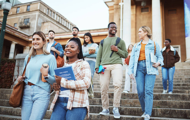 Diversity, students and walking on university steps, school stairs or college campus to morning class. Smile, happy people and bonding education friends in global scholarship opportunity or open day. - Foto, imagen
