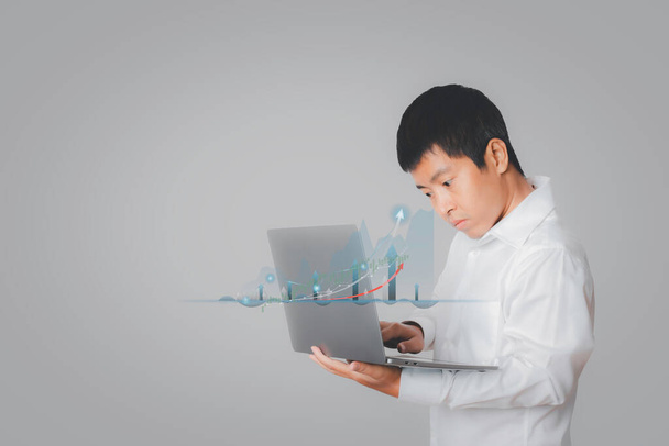 Businessman using laptop computer analysing forex trading graph financial data. Stock Market Investments analysis and Digital Assets. Business finance technology and investment concept. - Fotó, kép