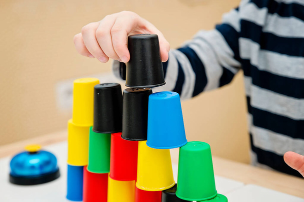 Color cap game. Sorting, counting, building. Children activities. Logical tasks for kids. Concentration and attention, patience, Montessori methodology. pursuit of the goal, strategy, new challenge. - 写真・画像