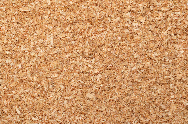 Coarse sawdust, wood chips, small chippings of wood, formed by sawing dried spruce. By-product and waste product, mainly used as additive for chipboards and wood pulp. Surface, background, from above. - Zdjęcie, obraz