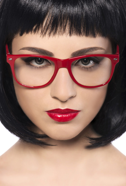 Gyönyörű fiatal nő, piros szemüveg. - Fotó, kép
