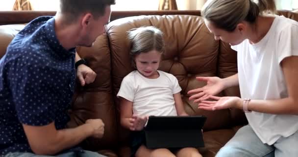Stop playing parents persuade and scold child daughter for tablet. Children addiction to gadgets and quarrels with children - Filmagem, Vídeo