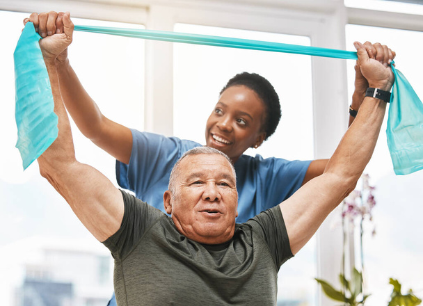 Physiotherapy help, stretching band and doctor with senior man in physical therapy, rehabilitation or healthcare support. Black woman chiropractor or physiotherapist consulting elderly patient. - Photo, Image