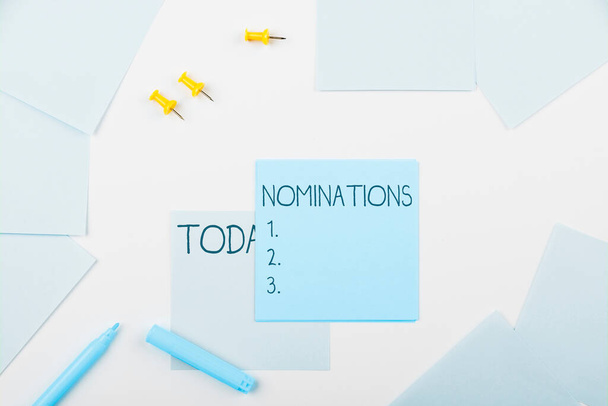 Scrivere il testo Nominations, Business concept l'atto di suggerire ufficialmente qualcuno per un lavoro o una posizione - Foto, immagini