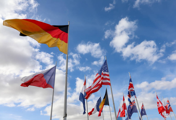 many flags of countries waving during the international meeting - Fotó, kép