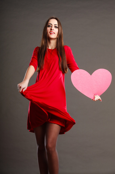 Woman in red dress holds heart sign - Photo, Image