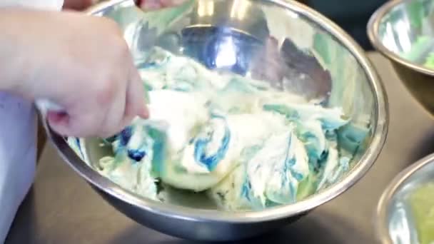 Baker making cream for cupcakes - Filmati, video