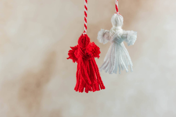 Traditional Martisor - symbol of holiday 1 March, Martenitsa, Baba Marta, beginning of spring and seasons changing in Romania, Bulgaria, Moldova. Greeting and post card for holidays. - Photo, Image