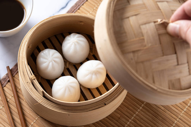Steamed dumplings on white marble background. Traditional oriental food - Foto, Imagen
