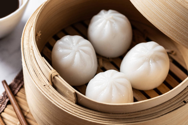 Steamed dumplings on white marble background. Traditional oriental food - Fotografie, Obrázek