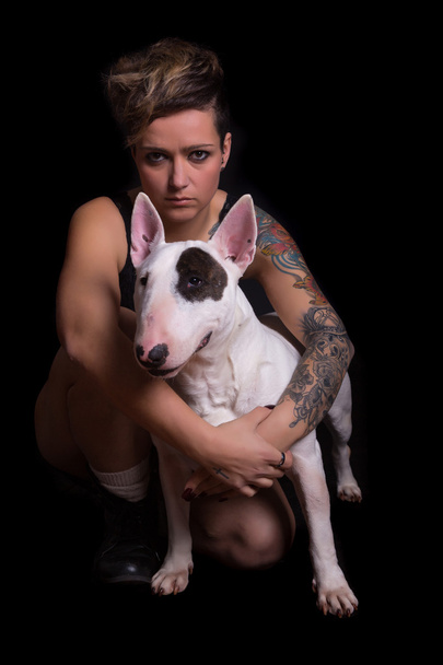 Tattooed Woman and bull terrier - Foto, Imagen