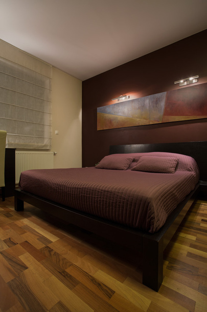 Dark bedroom with enormous bed - Фото, зображення