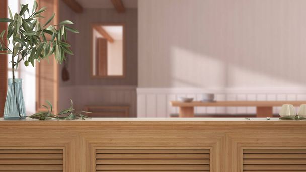 Wooden table top, cabinet, panel or shelf with shutters close up. Olive branch in vase and candles. Blurred background with japandi minimalist wooden dining room, interior design - Foto, Imagen