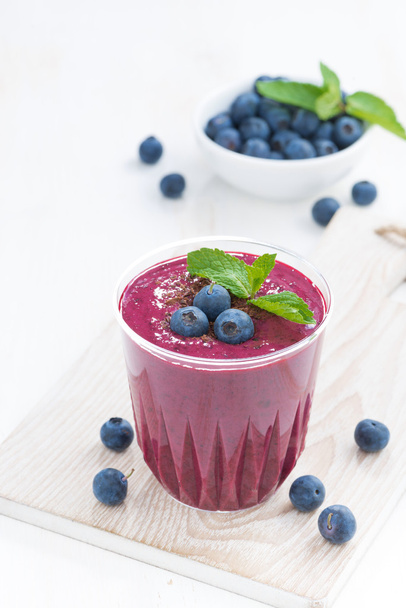 blueberry milkshake with mint and chocolate on a table - Zdjęcie, obraz